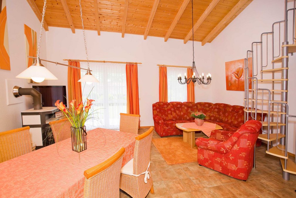 Cozy living room with fireplace stove, © Ringfoto Steindorf-Sabath