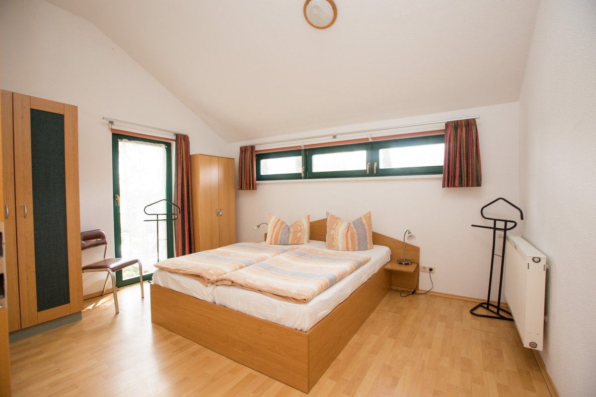 Slaapkamer in het vakantiehuis Waldschneise, © Ferienkontor Slaapkamer in het vakantiehuis Waldschneise, © Ferienkontor