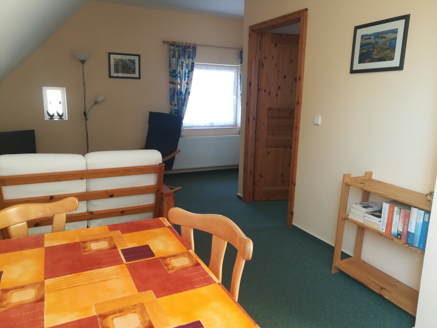 View into living room towards sitting area, © Andrea Schulze