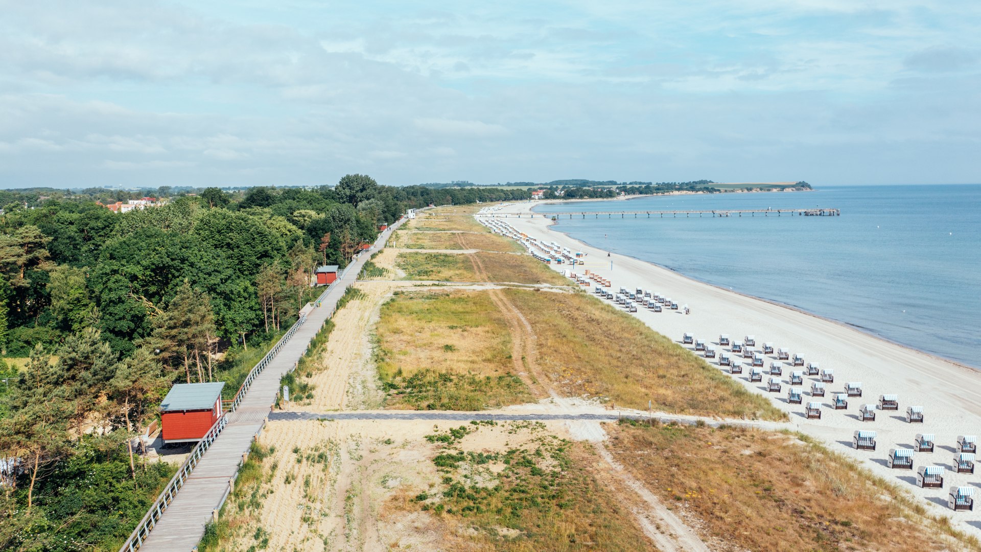 Drone shot of the Boltenhagen beach promenade and the beach with pier.
