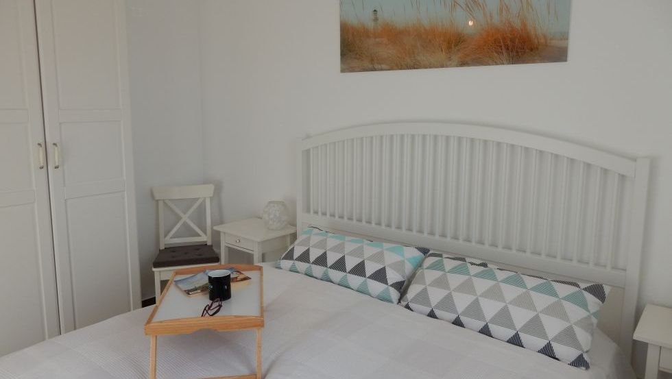 Przytulna sypialnia w domu wakacyjnym Familienzeit, © @cramer Przytulna sypialnia w domu wakacyjnym Familienzeit, © @cramer