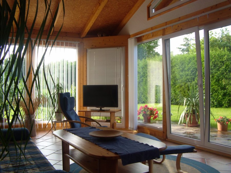 Living area and winter garden - interior view, © Bärbel Güldner