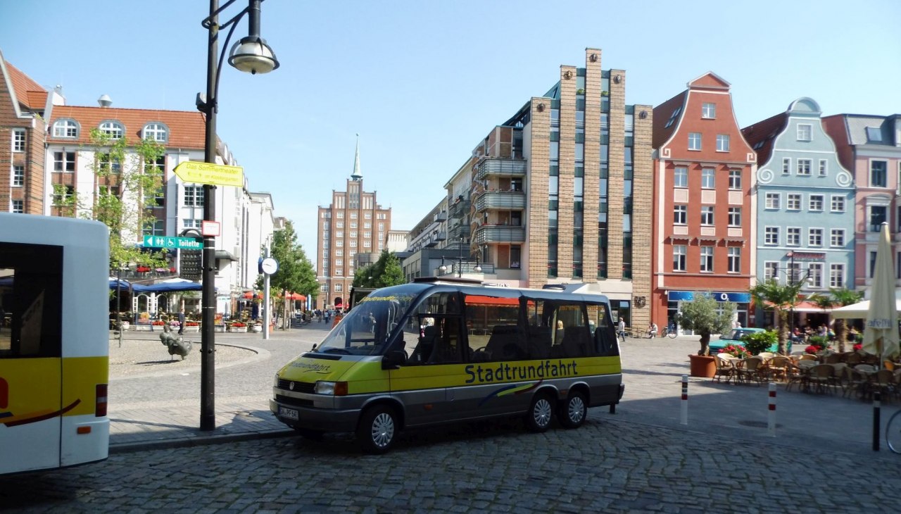 Our 12-seater panorama bus at the university square, © © SF