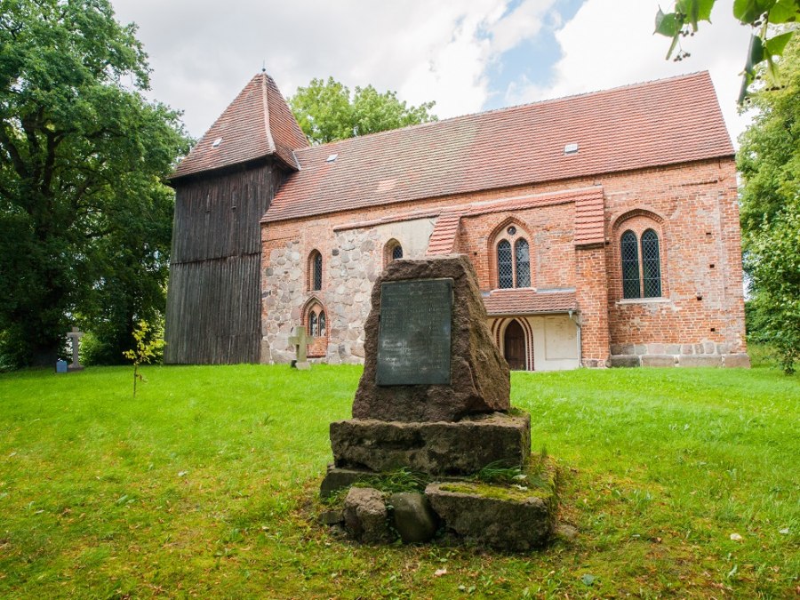 Village church side with memorial stone, © Frank Burger Village church side with memorial stone, © Frank Burger