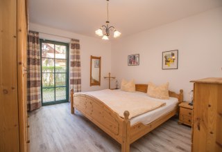Schlafzimmer im Ferienhaus Seeblick // &copy; Ferienkontor