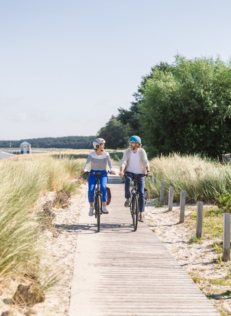 Cycle path along the coast of the seaside resort of Lubmin with two cyclists