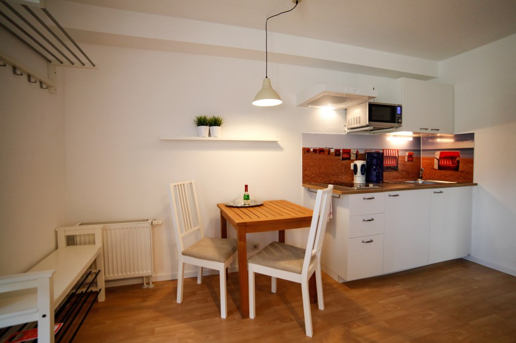 Kapitein Pahlen Ferienanlage - Terras flat kitchenette, © Captain Pahlen Ferienanlage