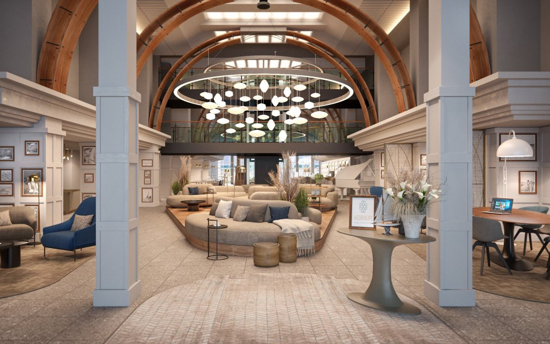 The central lounge area brings the surrounding nature into the lobby with sand-colored furniture, ocean-blue contrasts and spaciousness., © Mein Rügen Betriebsgesellschaft mbH