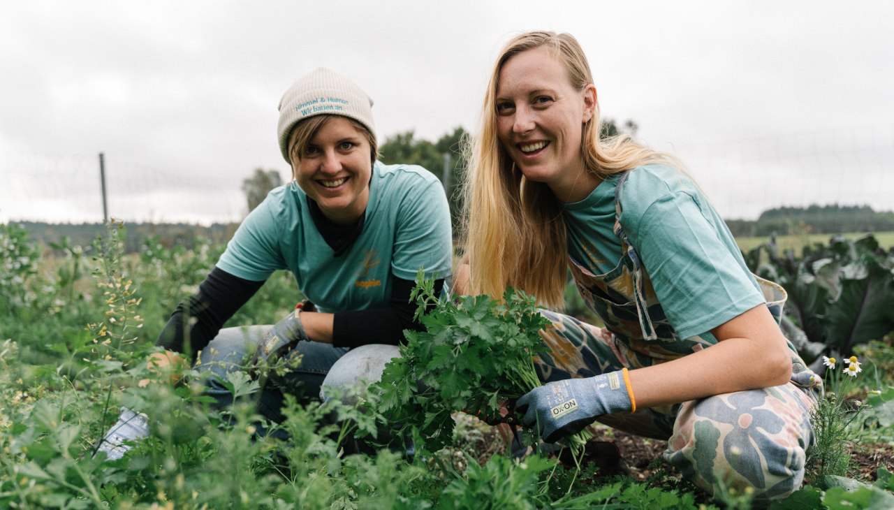Ceri and Sophie harvesting herbs, &copy; Michael Taterka