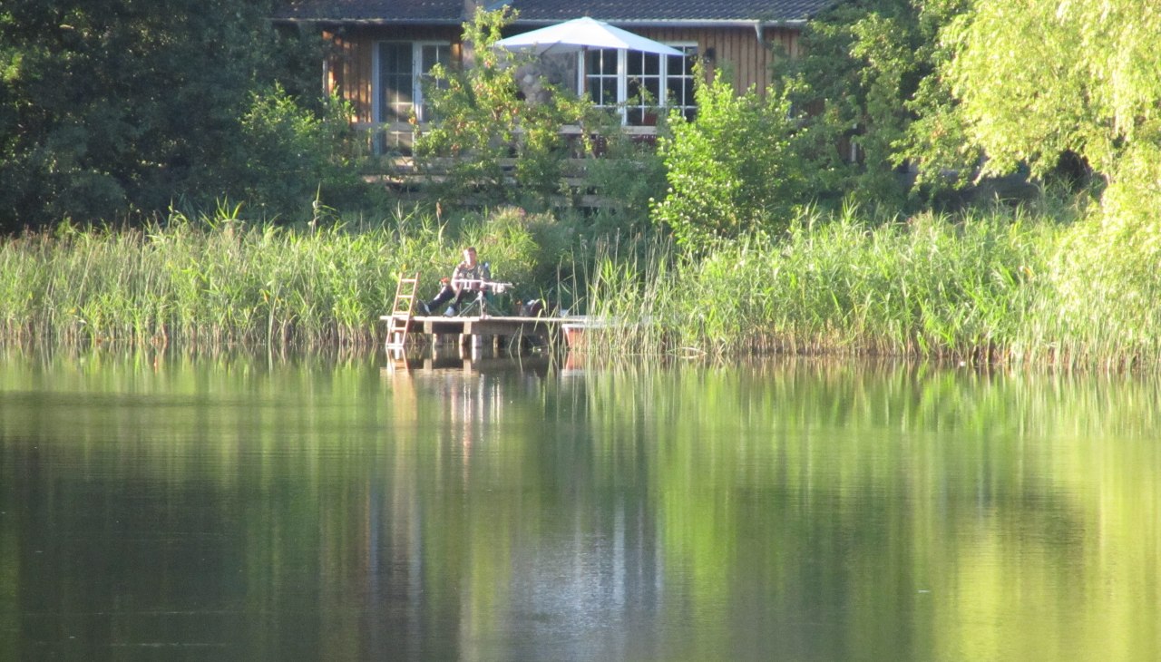 Reed house - fishing almost from the living room, &copy; Ewald Krombholz