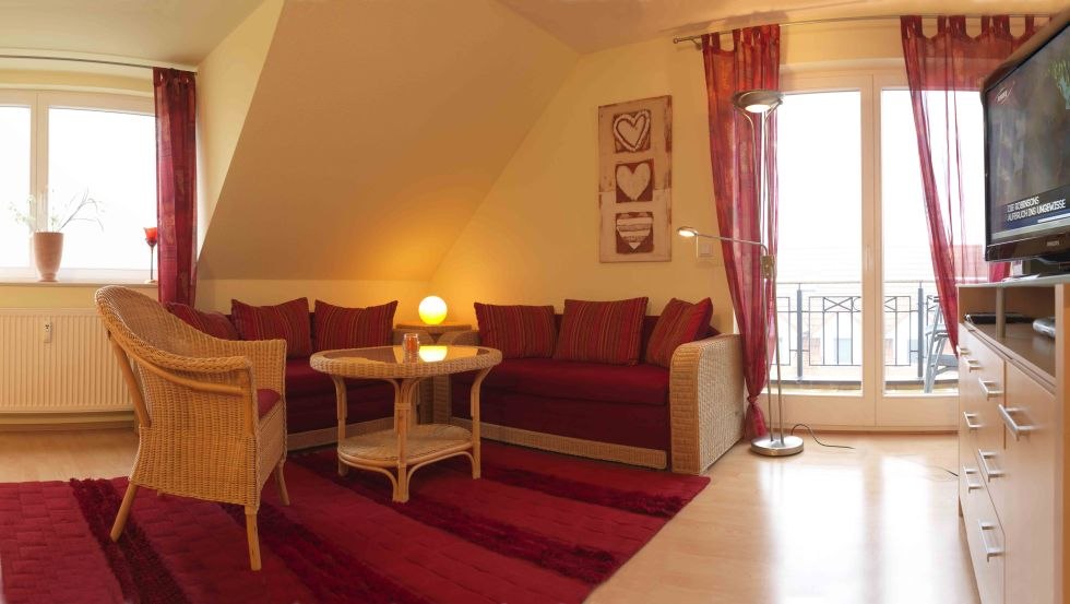 Living room in the apartment Meeresrauschen, &copy; Poeler Appartement Service GmbH