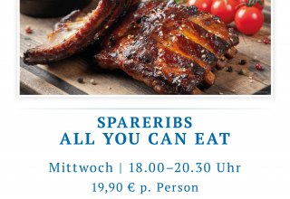 Juicy, glazed grilled spare ribs on a wooden board, with a BBQ sheen and light smoke. // &copy; spreepiraten&reg;