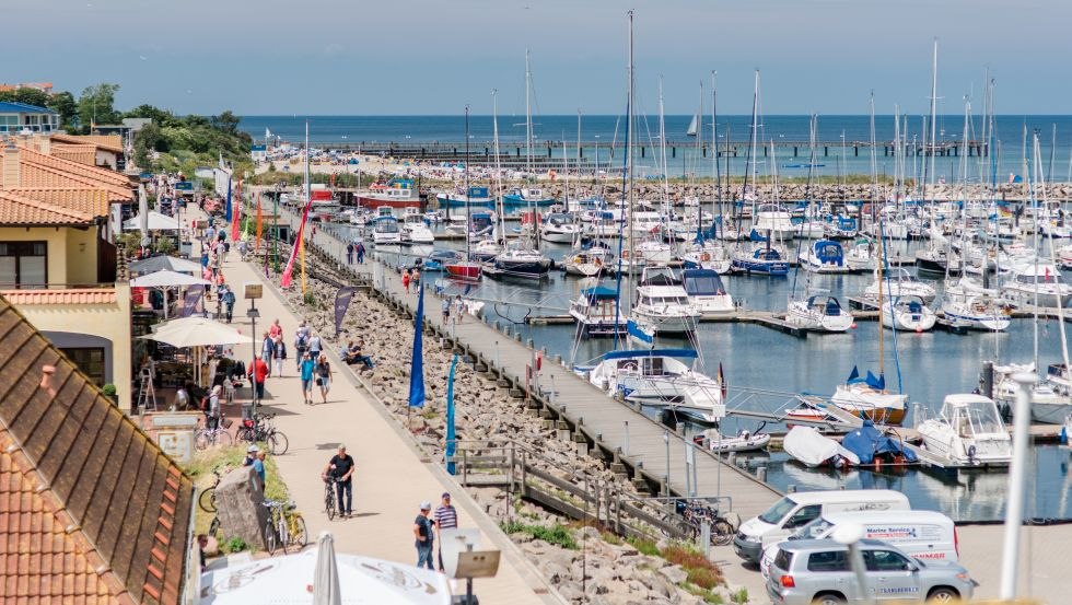 The lively promenade at the boat harbor is a popular attraction for locals and guests., &copy; Friederike Hegner