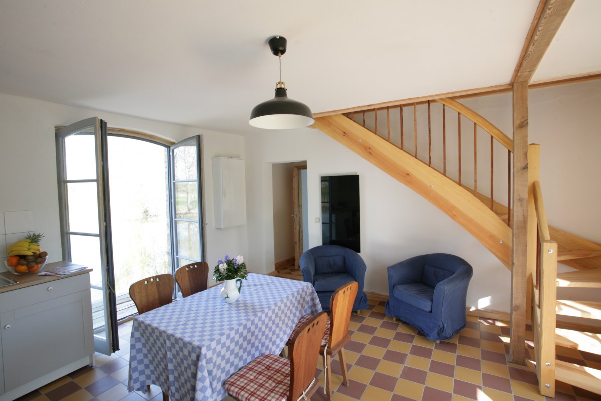 Living room - vacation apartment left rose house // &copy; Hahn