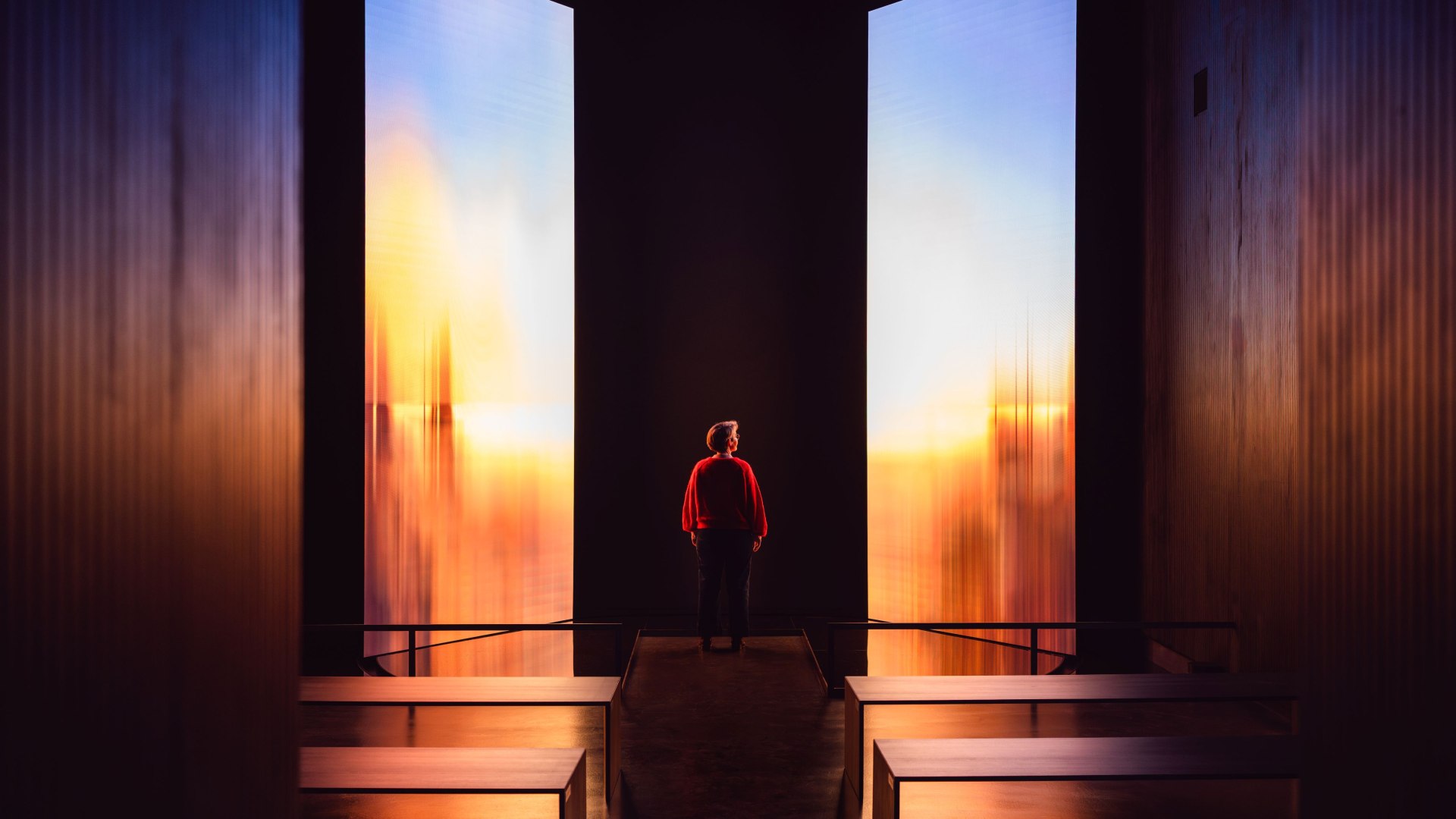 Birte Frenssen, curator and deputy director of the Pomeranian State Museum, in front of an illuminated art installation.