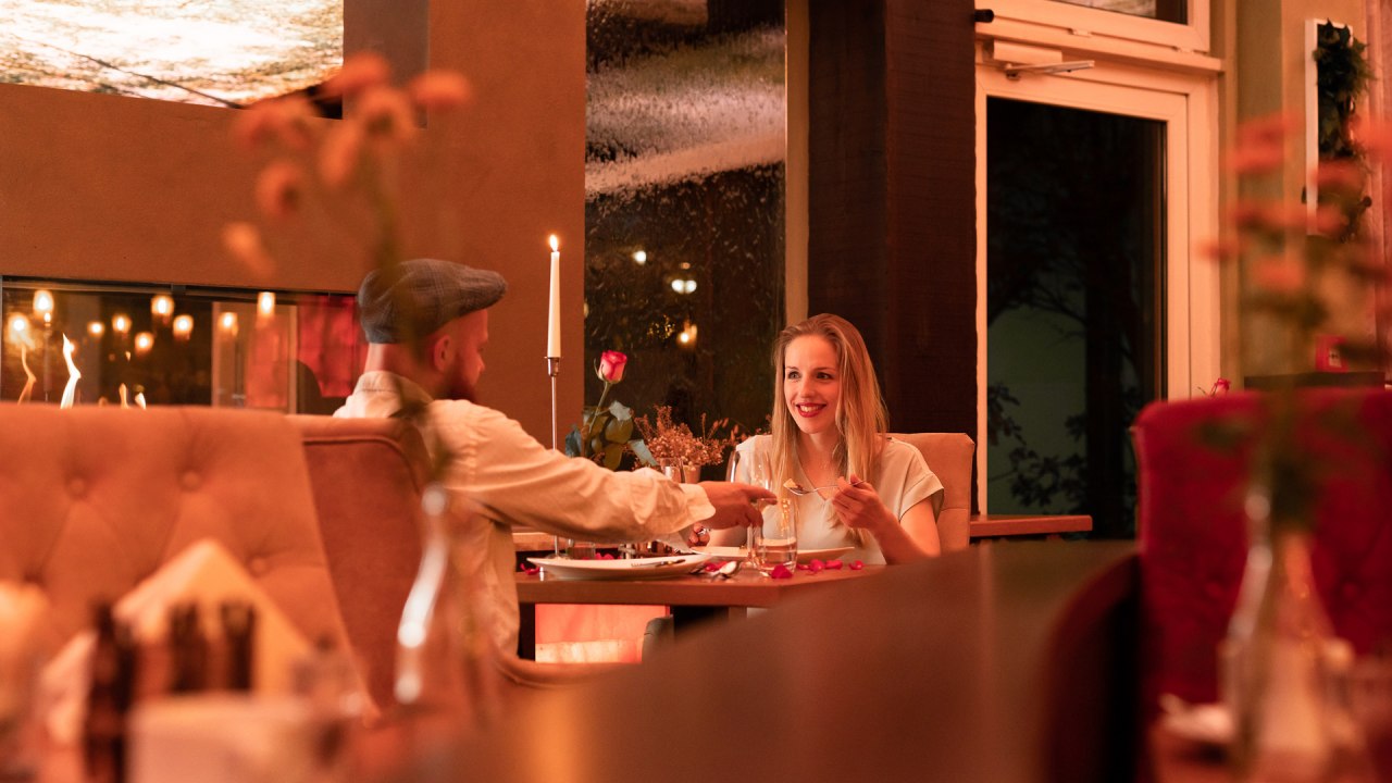 Dinner by the fireplace, &copy; TRIHOTEL Rostock