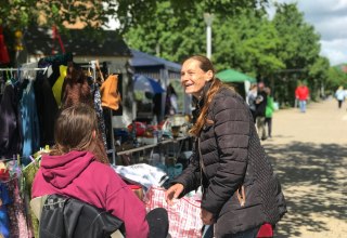 "A moment full of encounters: between the clothes racks, sunshine and little treasures, our flea market is not just about buying and selling - it's about chatting, laughing and enjoying each other's company." // &copy; LGE-MV