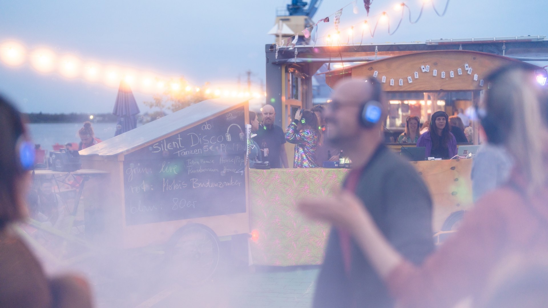 Dancing at the Silence Disco at the Rostock city harbor at Rostdock_01, &copy; TMV/Gross