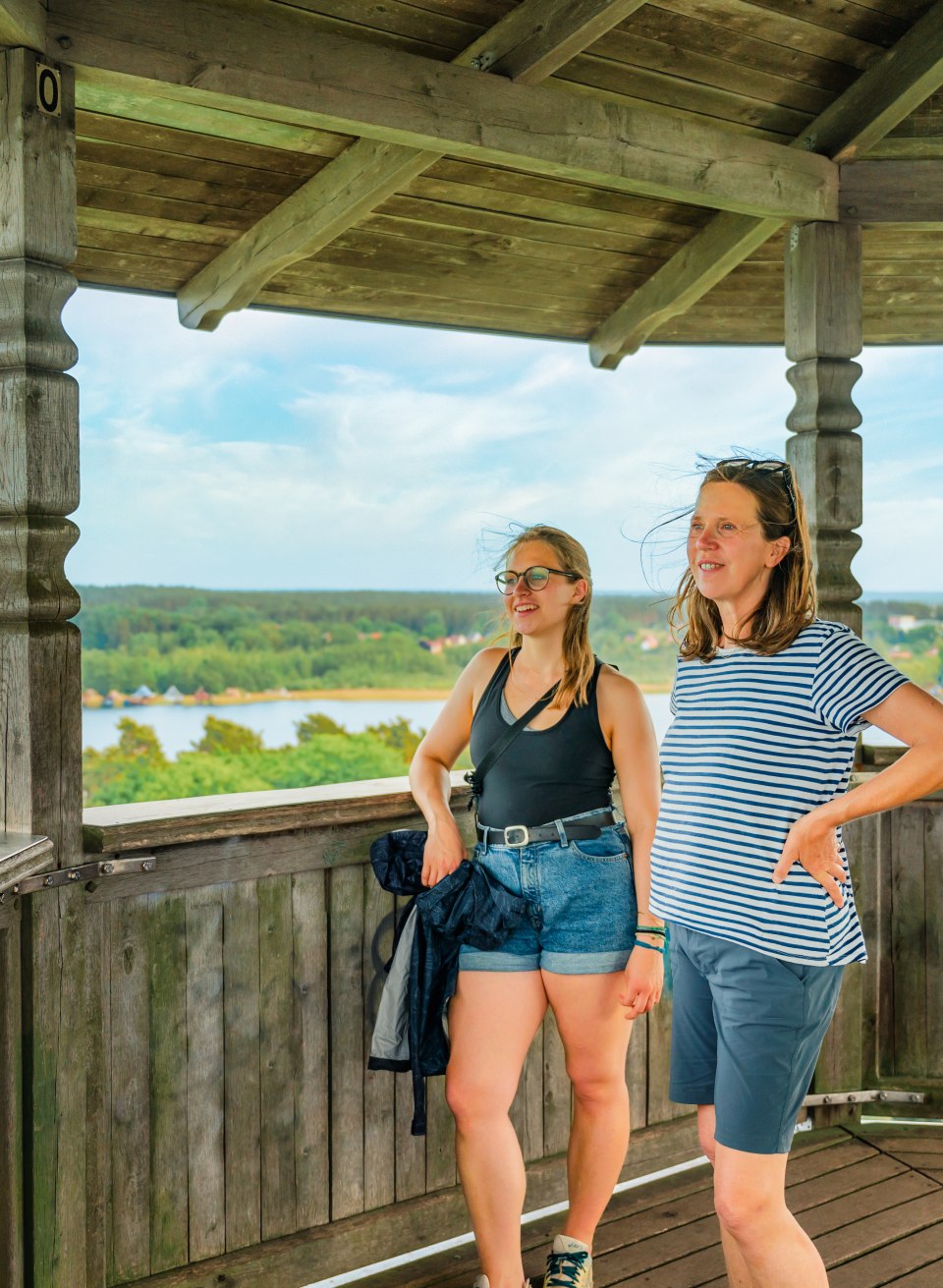 Mother and daughter look out over nature from the Krakow observation tower