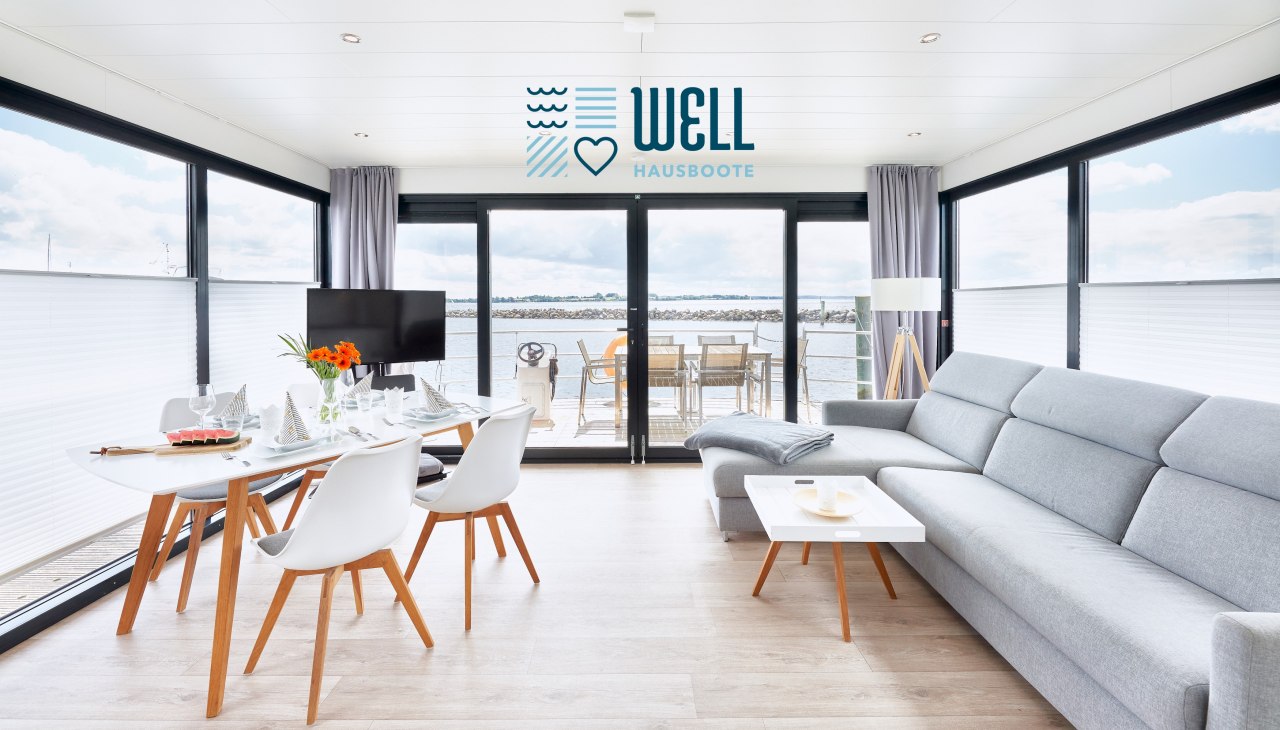 Houseboat interior living / dining room with large sliding door to the bow terrace, &copy; Lars Franzen