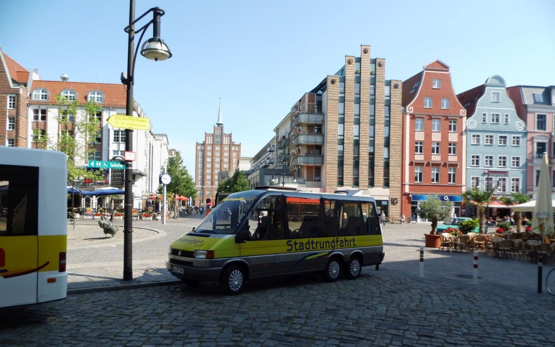 Our 12-seater panorama bus at the university square, © © SF